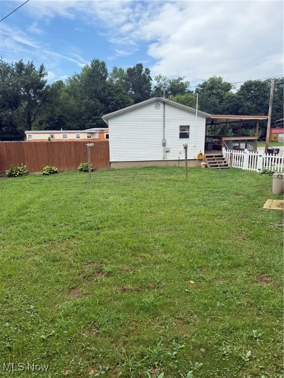 View of fenced backyard
