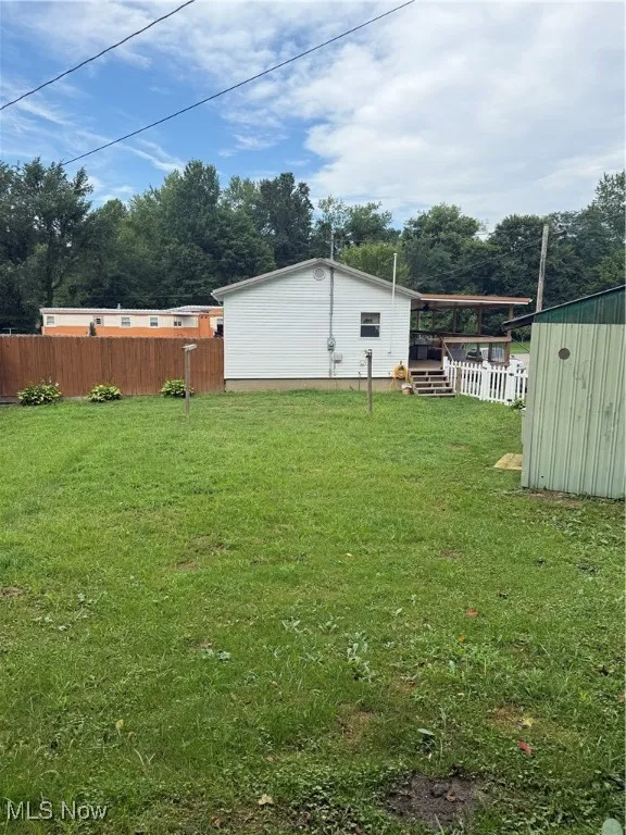 View of yard featuring a storage shed