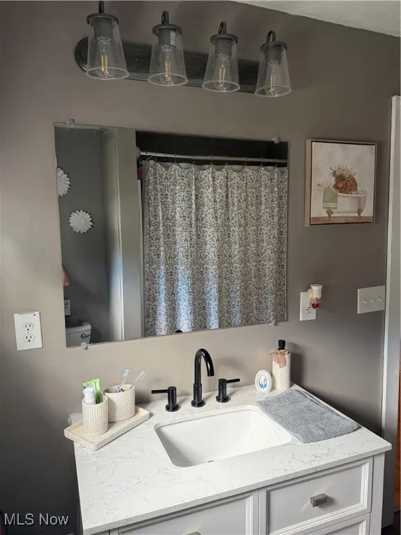 Full bathroom with vanity