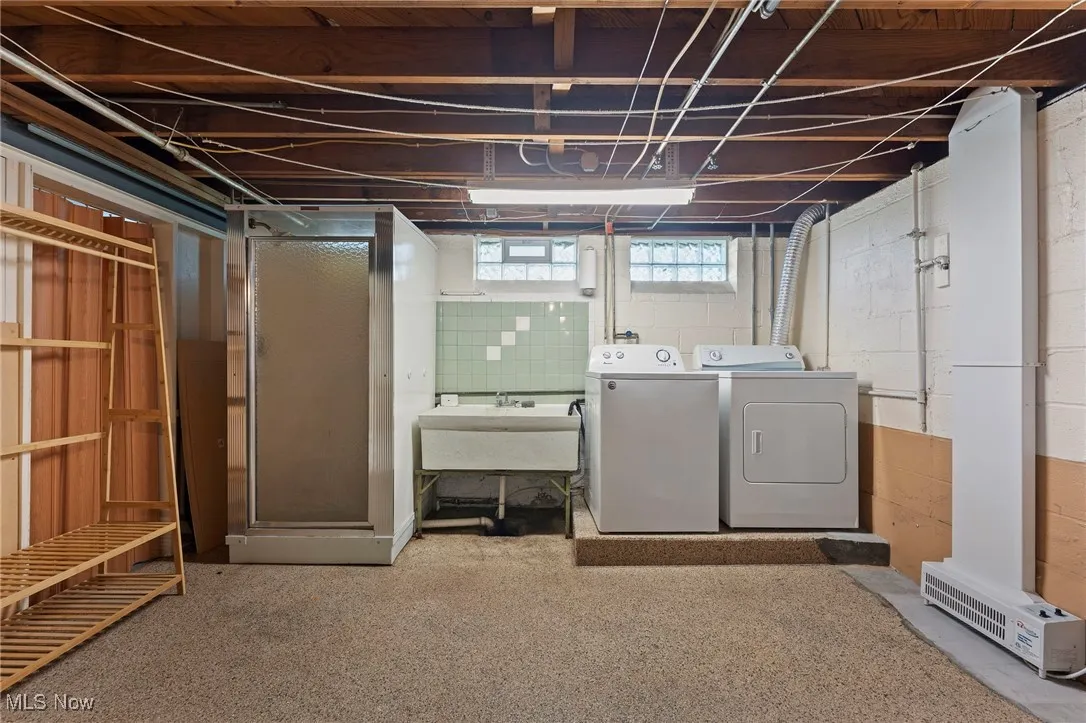 Basement with washer and clothes dryer