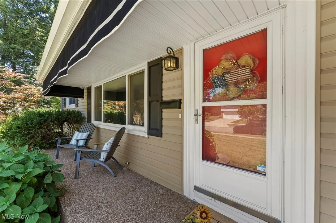 View of exterior entry with covered porch
