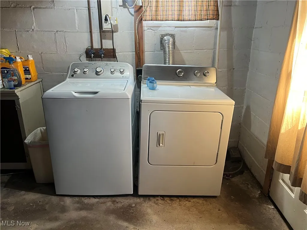 Laundry room featuring washing machine and clothes dryer