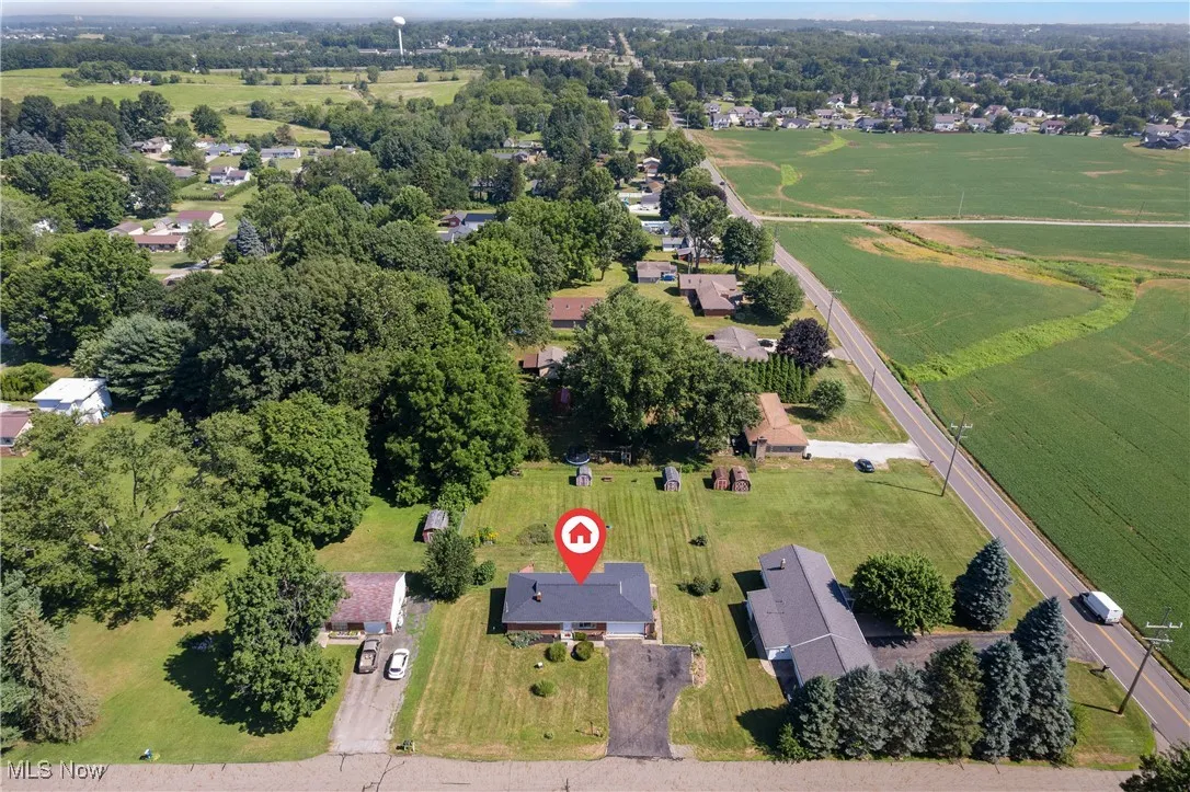 Aerial overview of property's location featuring nearby suburban area