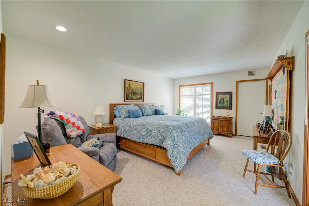 Master Bedroom with sliding door out to the scenic court yard area.