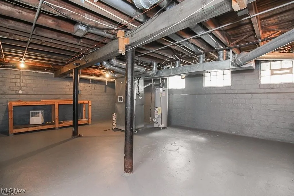 Basement with gas water heater and heating unit