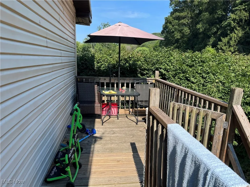 Wooden deck with outdoor dining area
