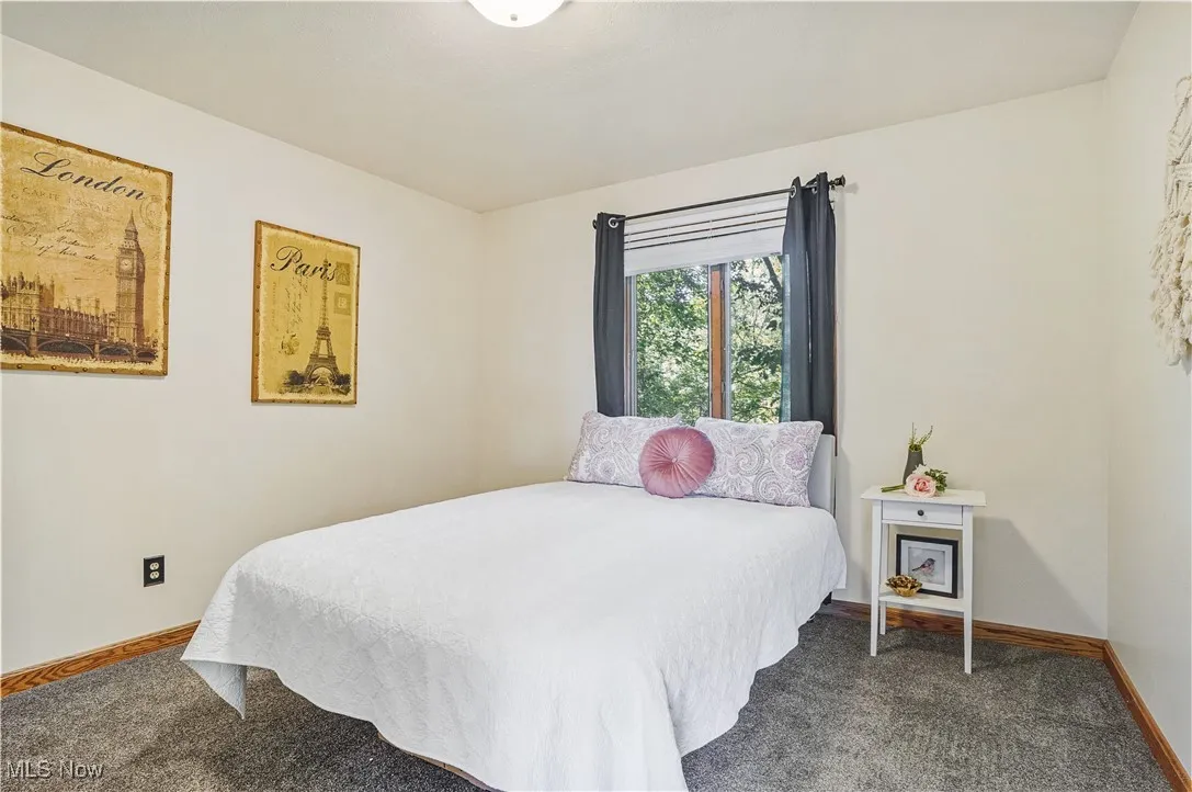 Carpeted bedroom with baseboards