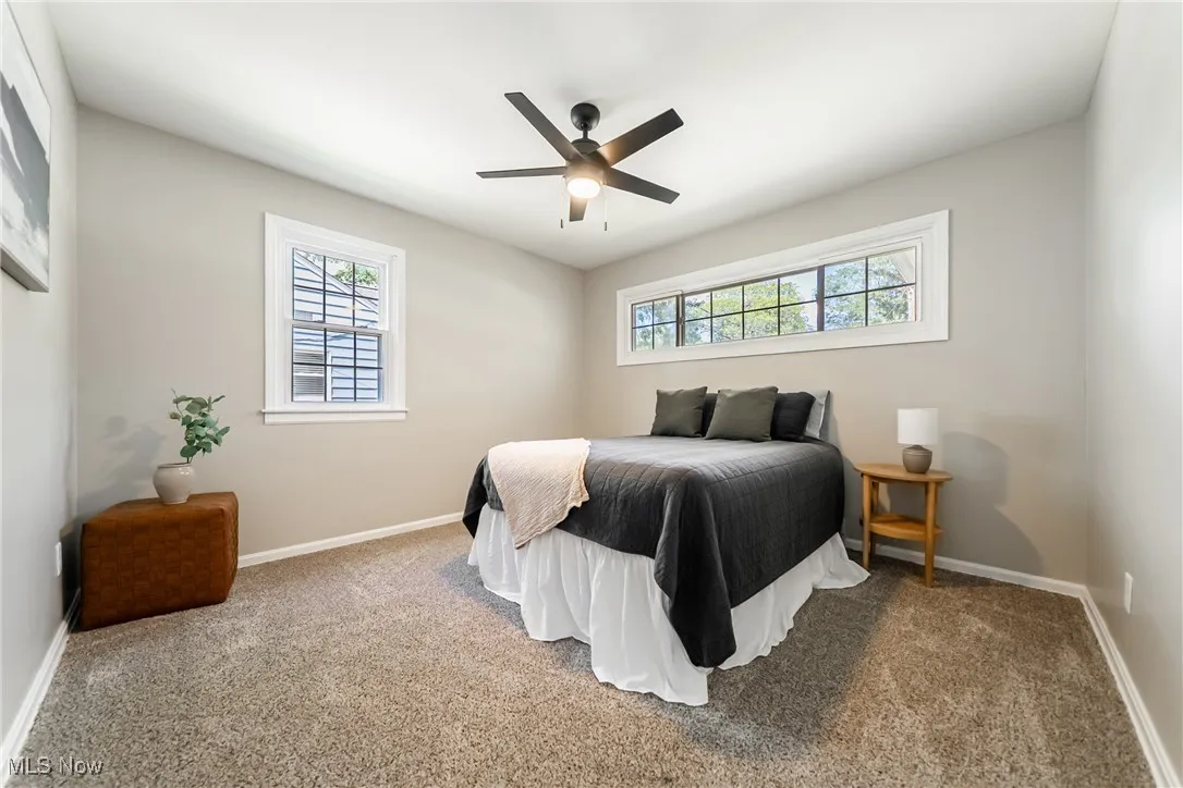 Bedroom with carpet and ceiling fan