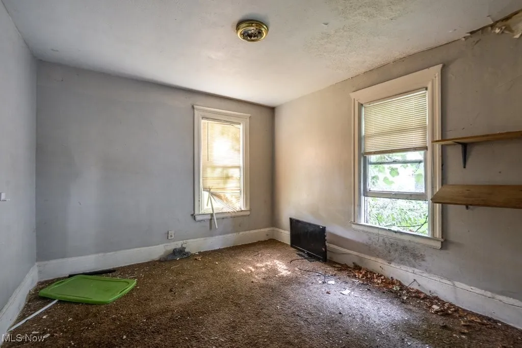 Spare room with baseboards