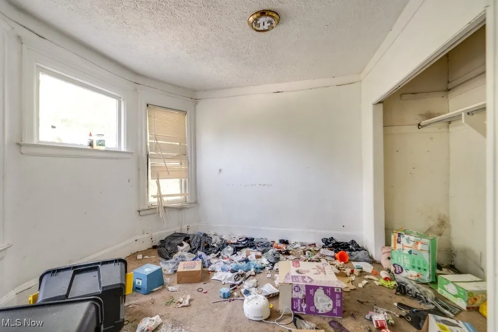 Unfurnished bedroom with a textured ceiling