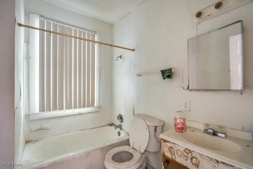 Bathroom featuring vanity and bathtub / shower combination