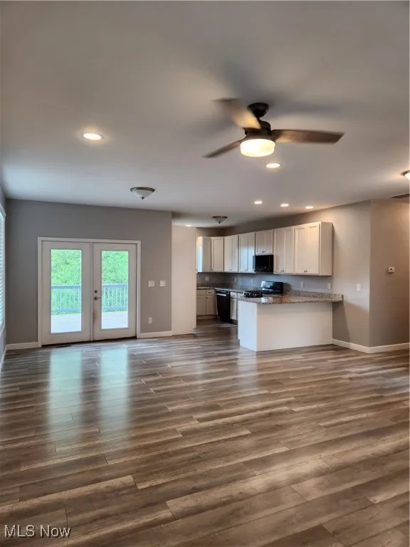 Kitchen featuring dark wood-type flooring, recessed lighting, a peninsula, white cabinetry, and ceiling fan