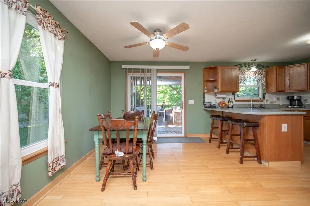 Dining room featuring light wood-style floors and ceiling fan