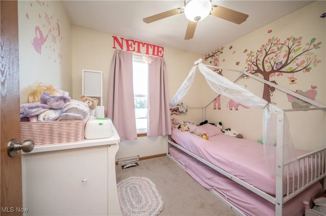 Bedroom featuring carpet flooring and a ceiling fan