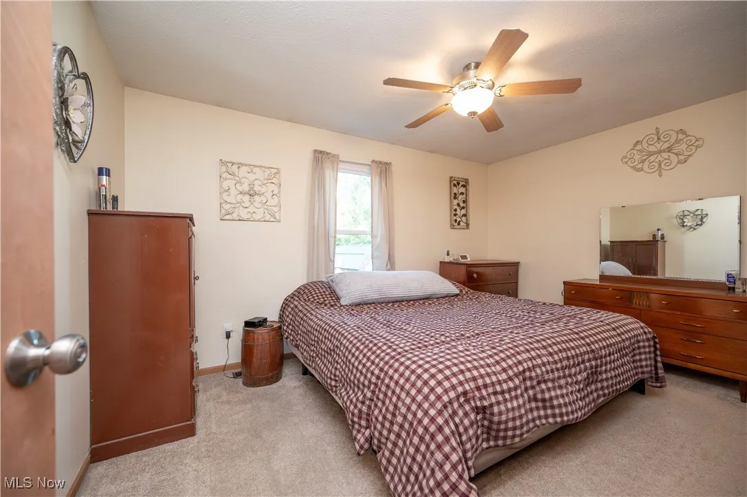 Bedroom featuring carpet floors and ceiling fan