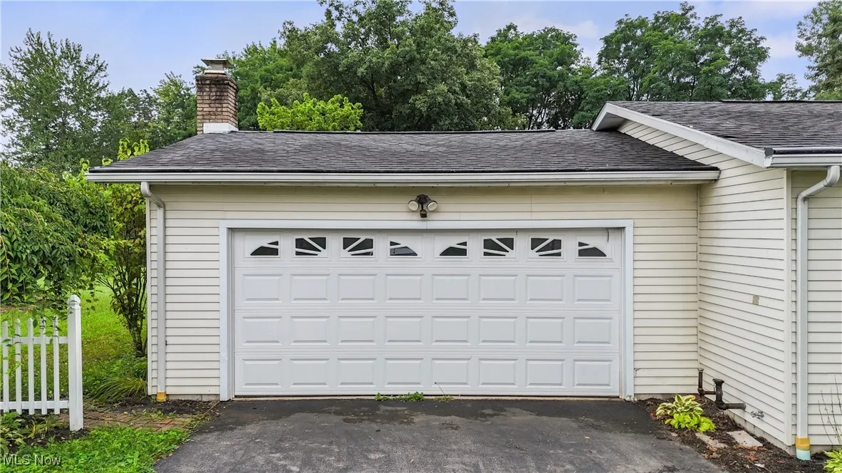 Garage featuring driveway