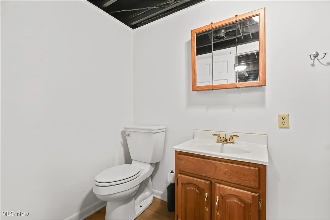 Half bath with toilet and vanity