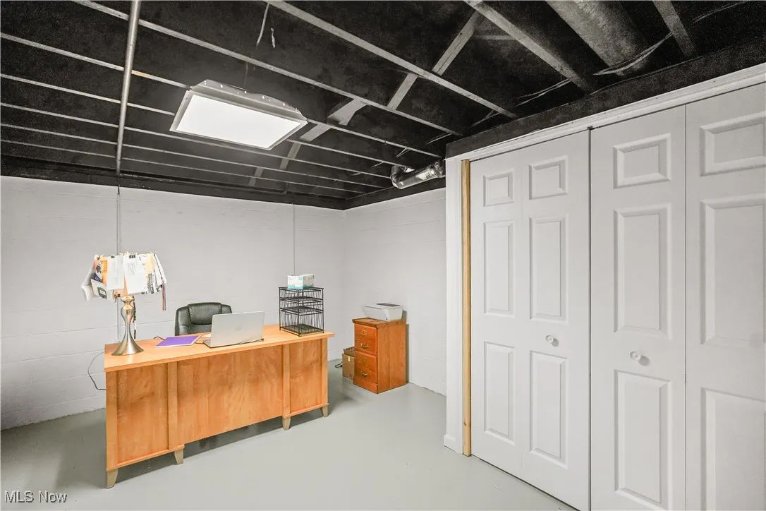 Office area featuring concrete flooring