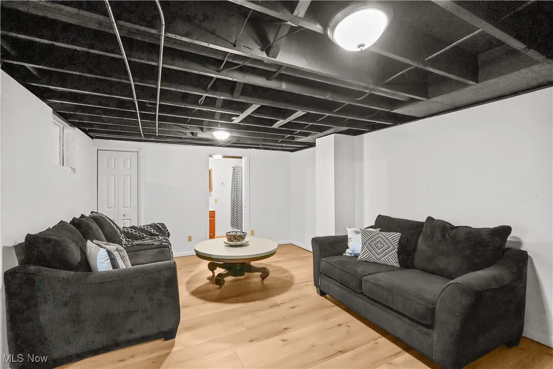 Living room with wood finished floors and baseboards