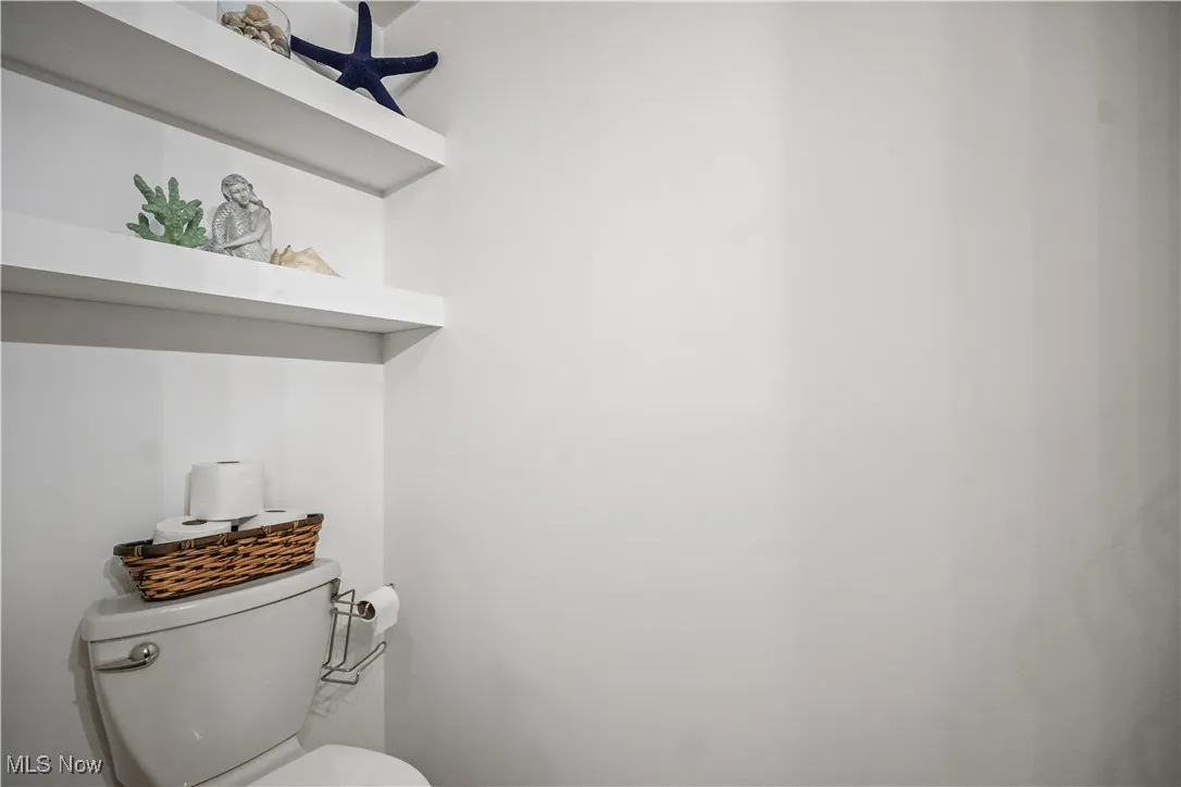 Half bath featuring toilet