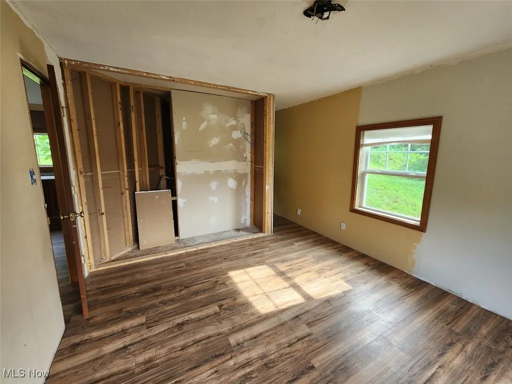 Spare room with wood finished floors