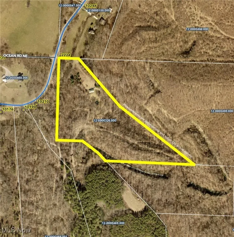 Aerial map of property and surrounding area with property boundaries highlighted
