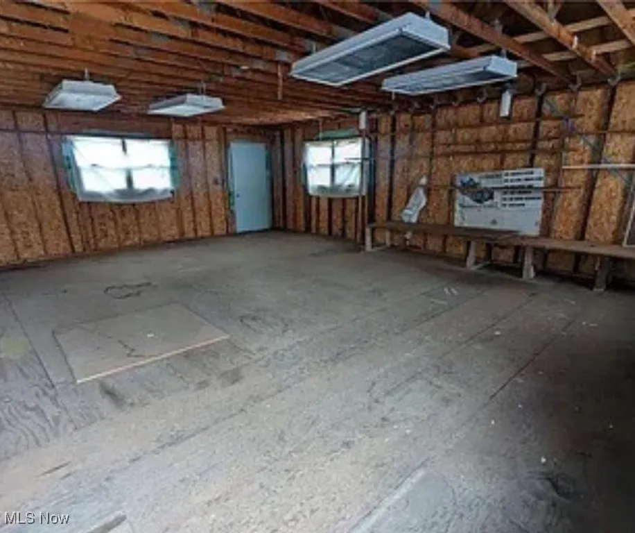 Miscellaneous room featuring healthy amount of natural light and a garage