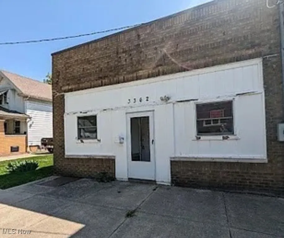 View of front of house featuring brick siding