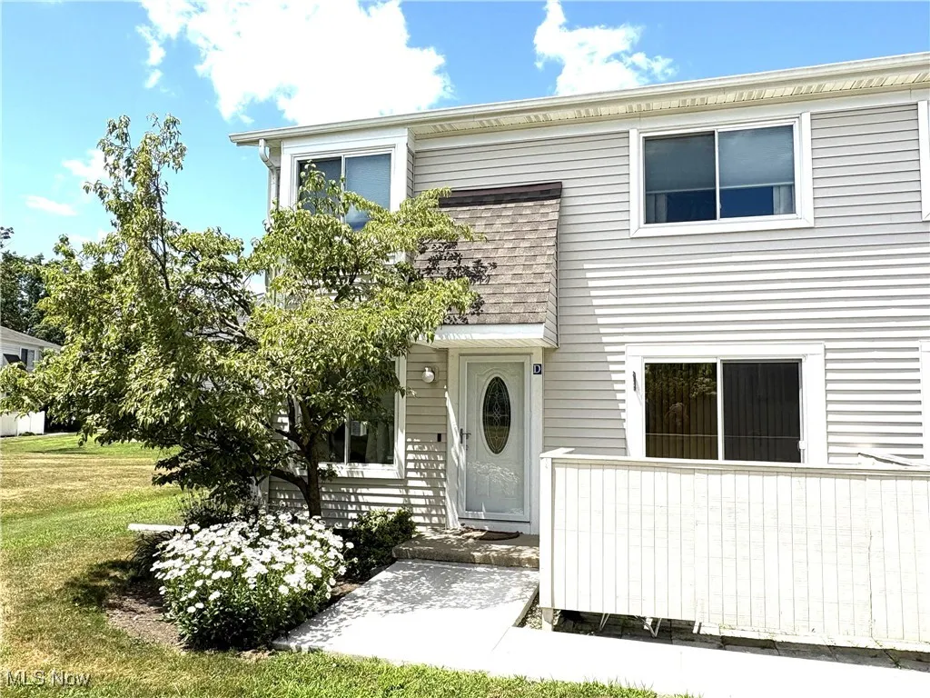 View of front of home , enclosed patio