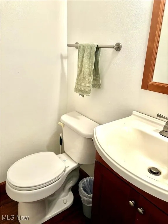 Half bathroom with vanity and LVT floors
