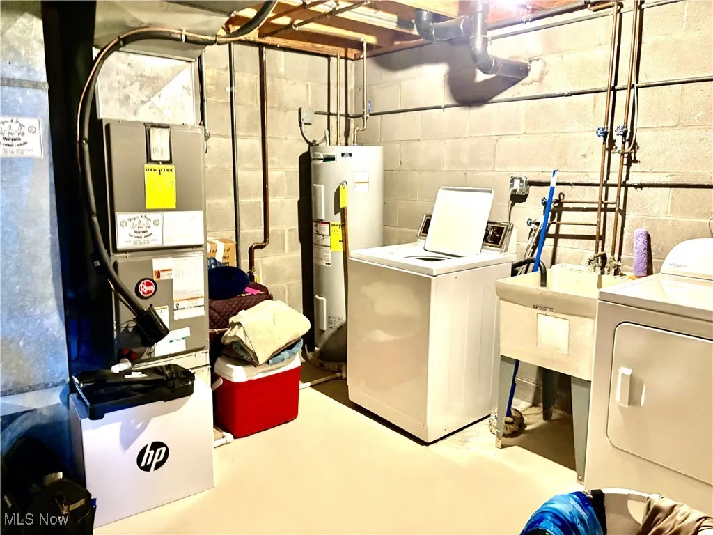 Laundry room with washing machine and clothes dryer