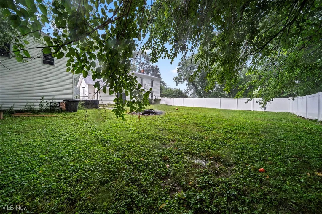 View of fenced backyard