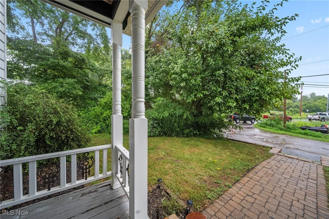 View of yard with covered porch