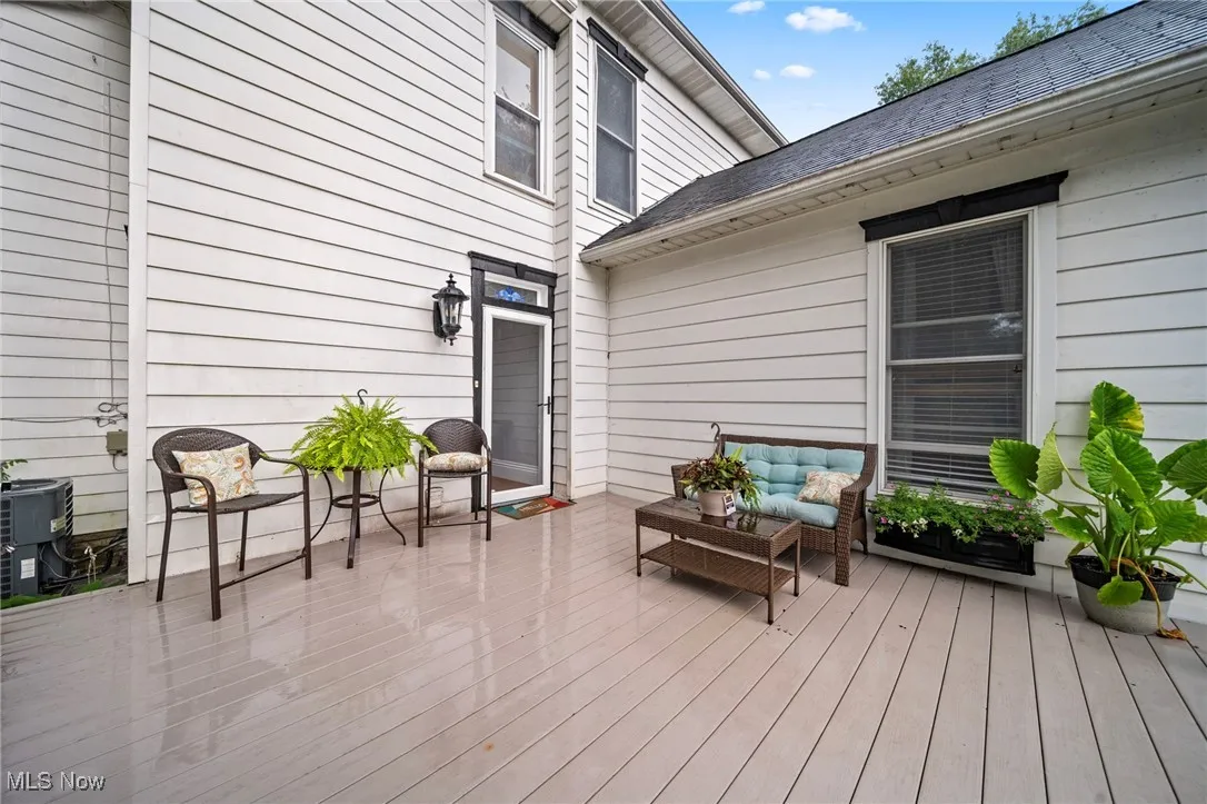 Wooden terrace featuring an outdoor hangout area