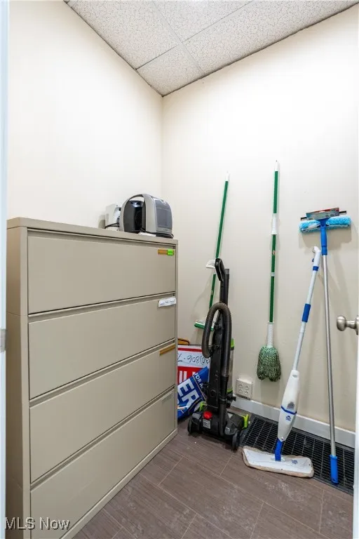Workout area featuring a paneled ceiling