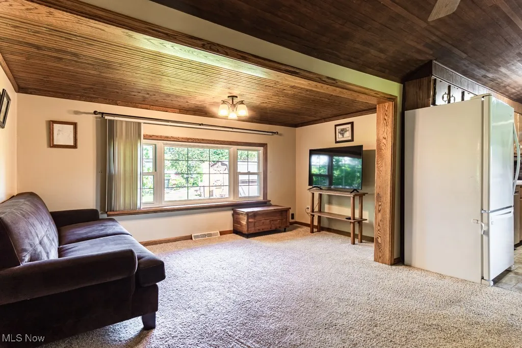 Living room, with kitchen on the right