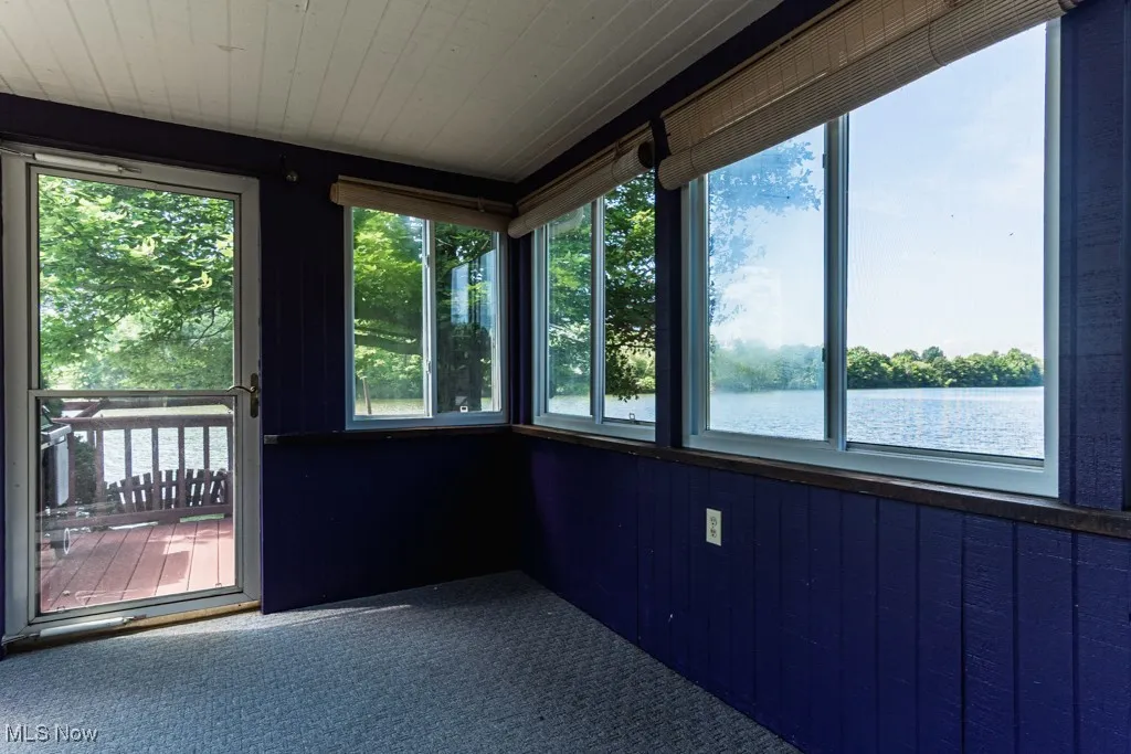 3 seasons room with door to deck to lake, views of lake out window