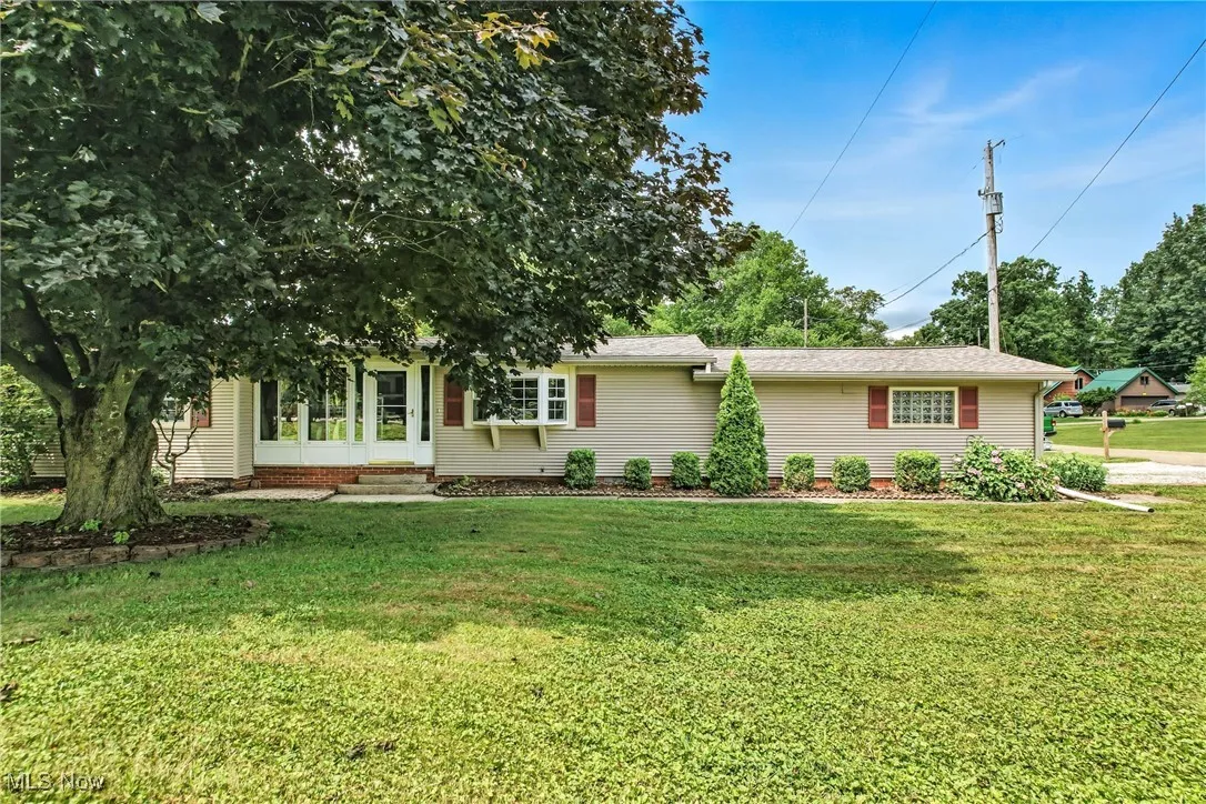 Front of home with enclosed porch