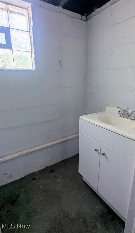 view of half bath in lower level