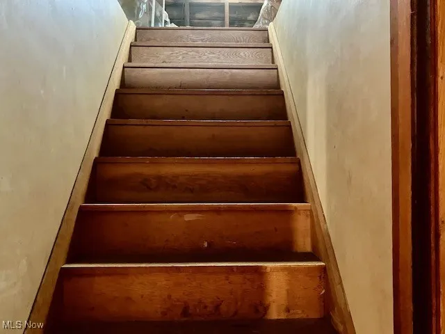 Stairs to house attic. Could be third bedroom