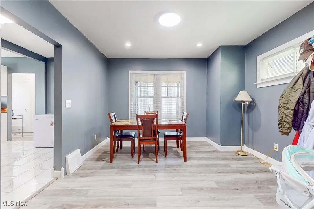 Dining space featuring light wood-style floors and recessed lighting