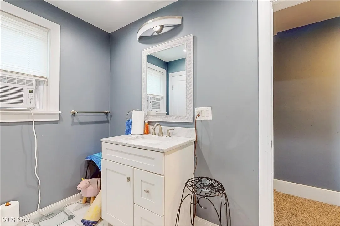 Bathroom featuring vanity and cooling unit