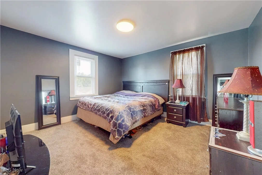 Bedroom with carpet and baseboards