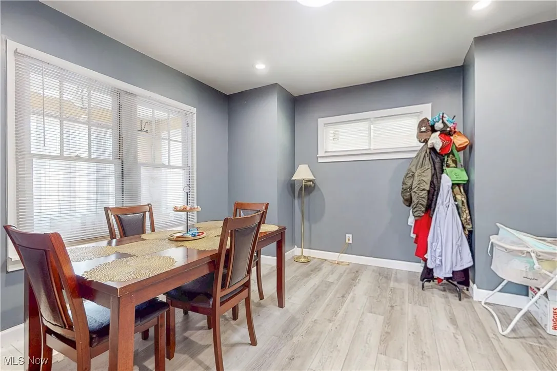 Dining area featuring light wood-style flooring and recessed lighting
