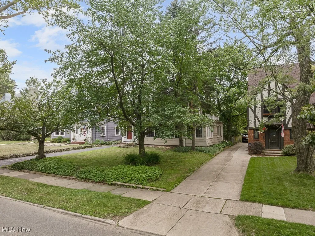 View of front of property with a front lawn and brick siding