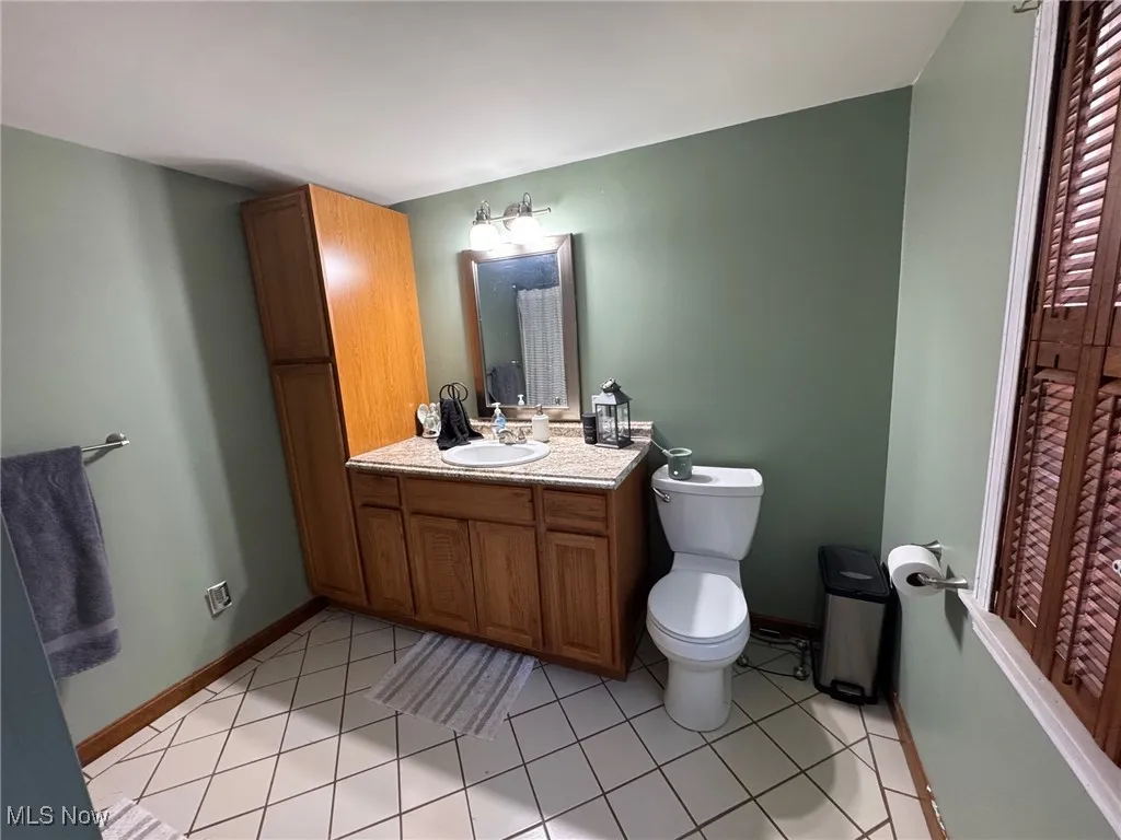 Bathroom featuring vanity and ceramic tile floors