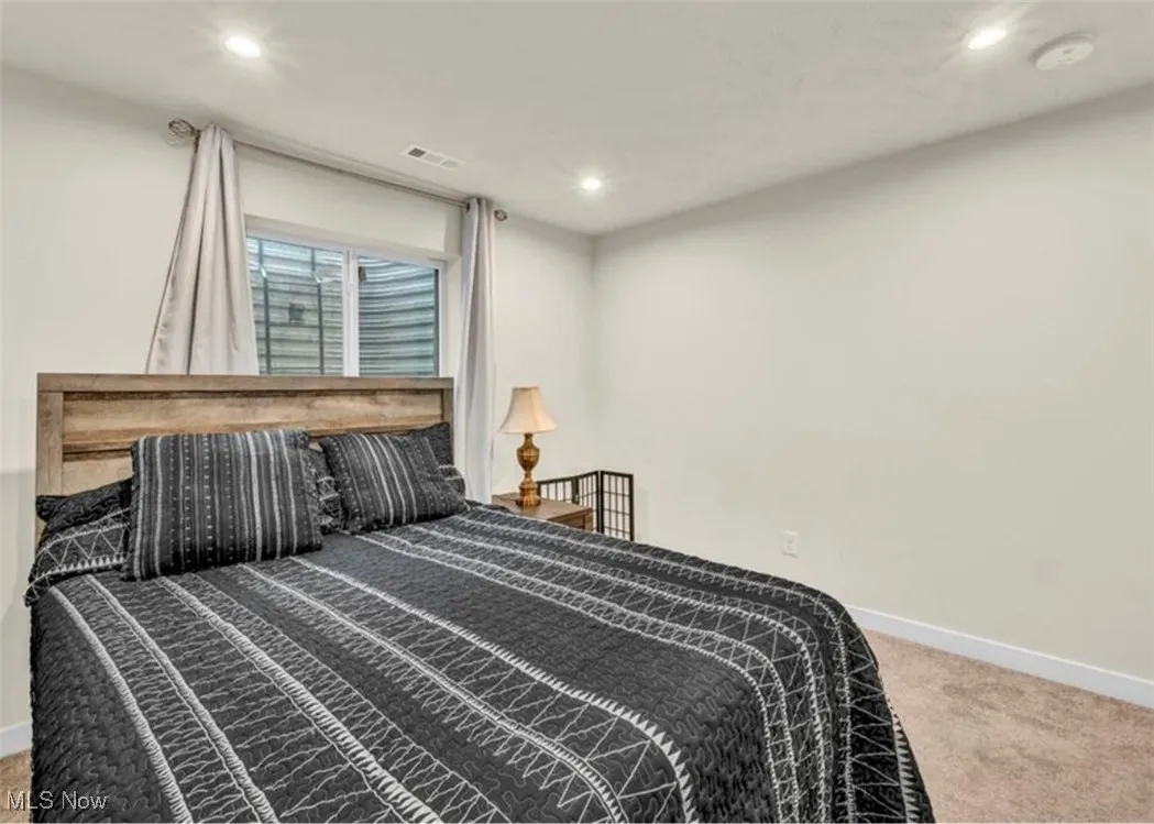 Bedroom with carpet flooring and recessed lighting