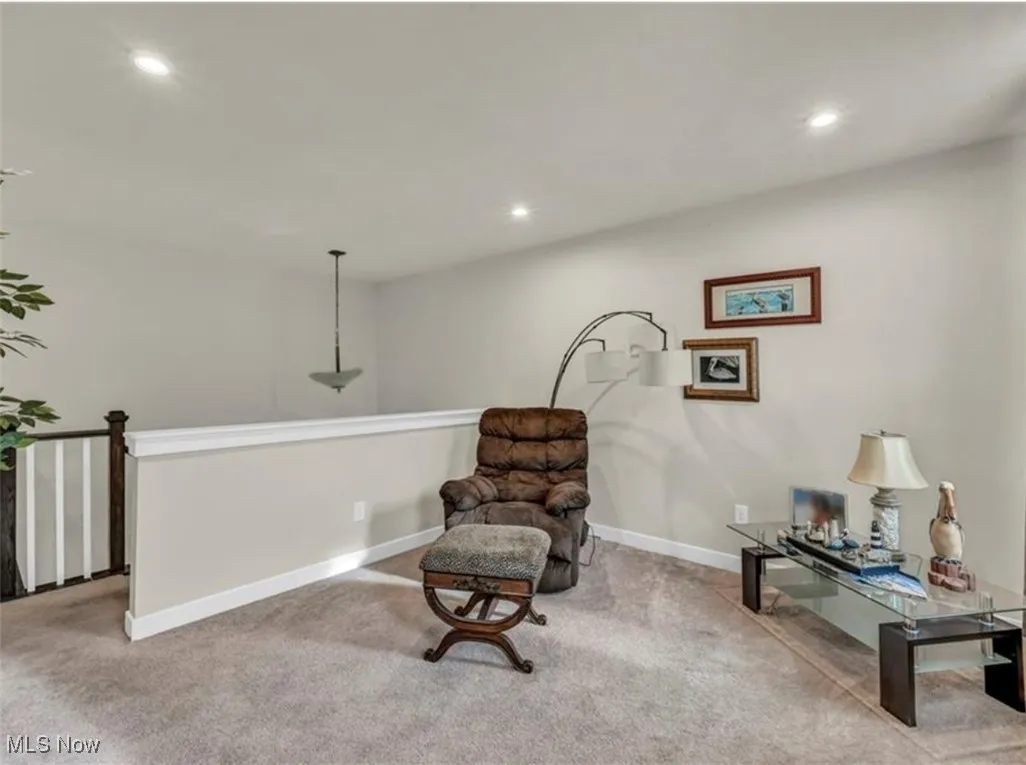 Sitting room with carpet and recessed lighting