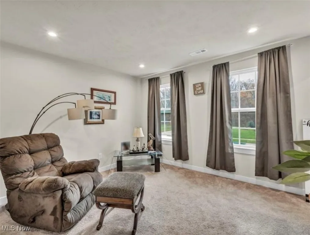 Sitting room featuring carpet flooring and recessed lighting