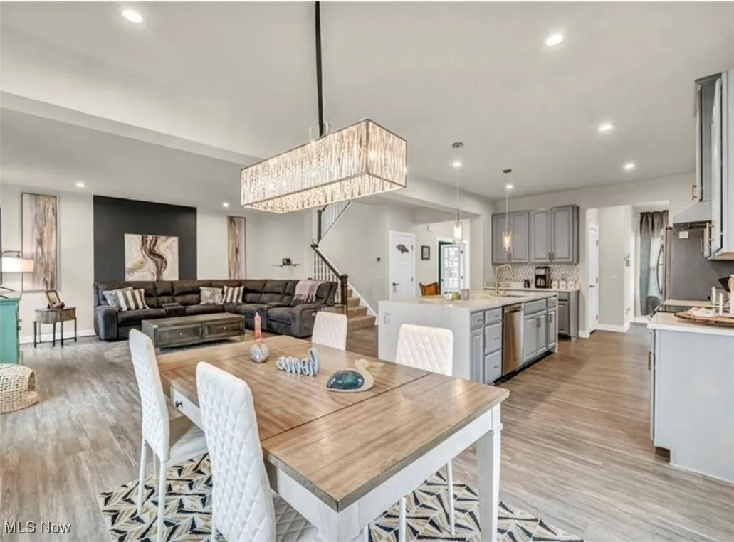 Dining space featuring recessed lighting and light wood-type flooring